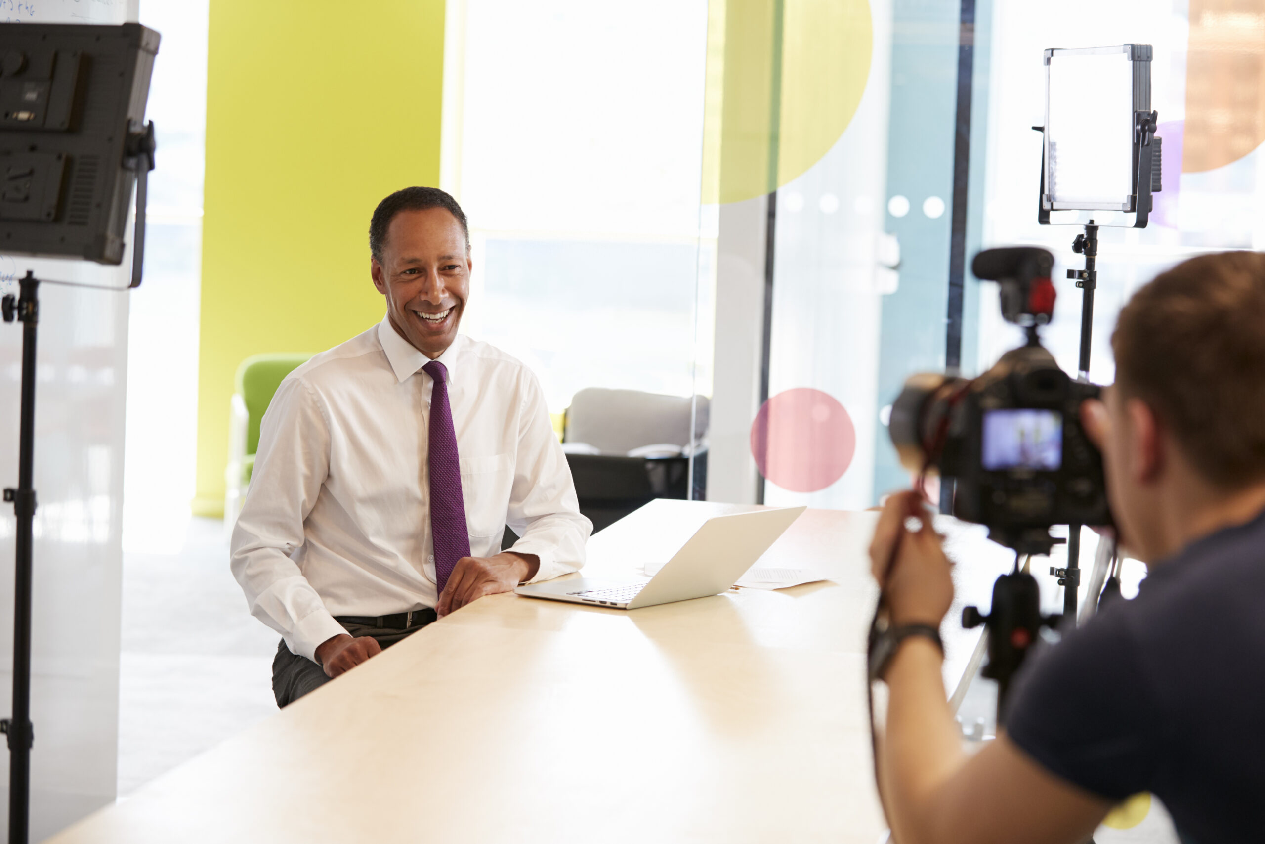 start-up video creation with businessman being filmed