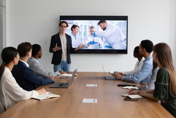 medtech start up owner presenting video promos to potential investors